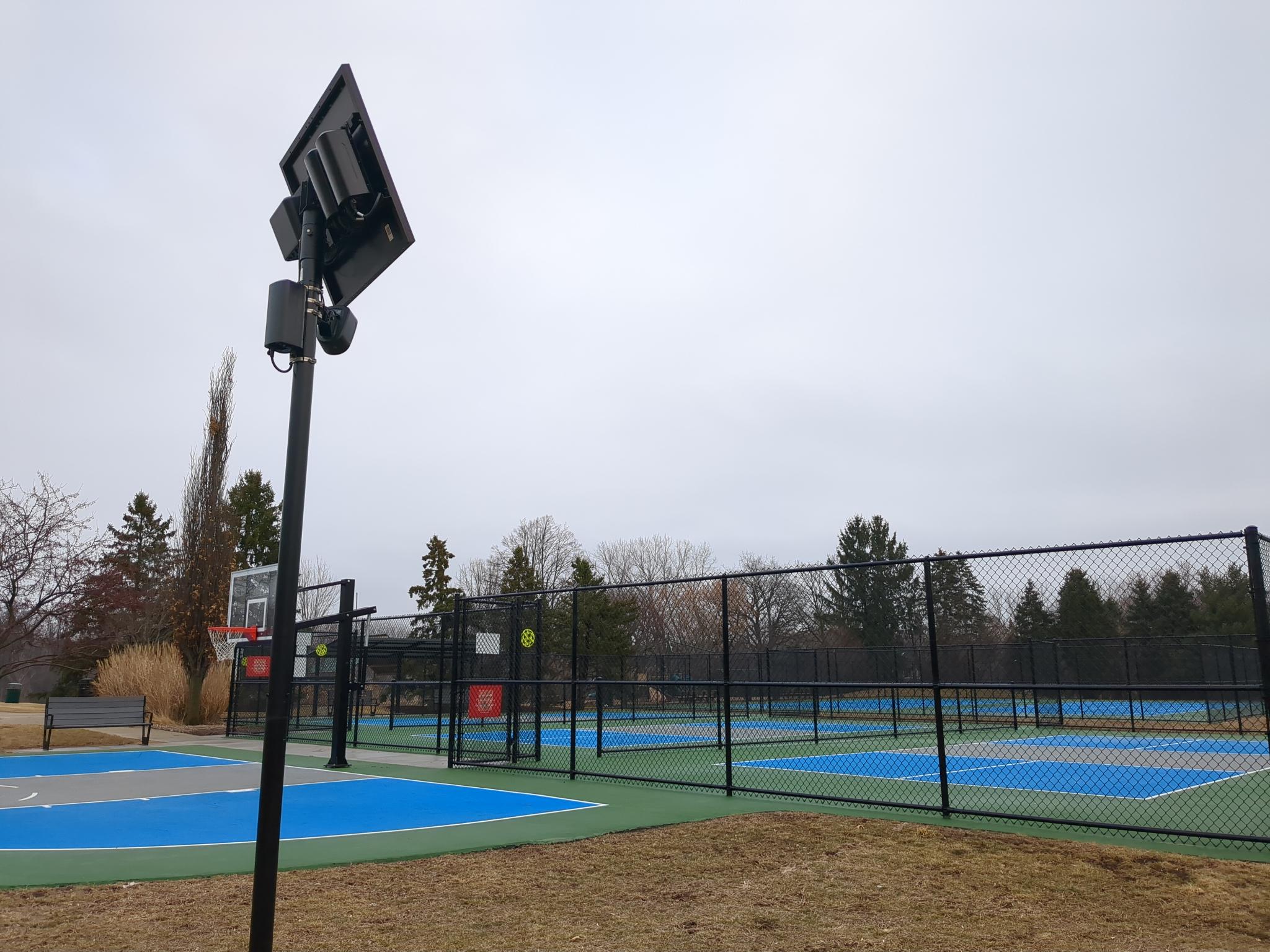 Set of Flock LPR cameras facing basketball and pickleball courts